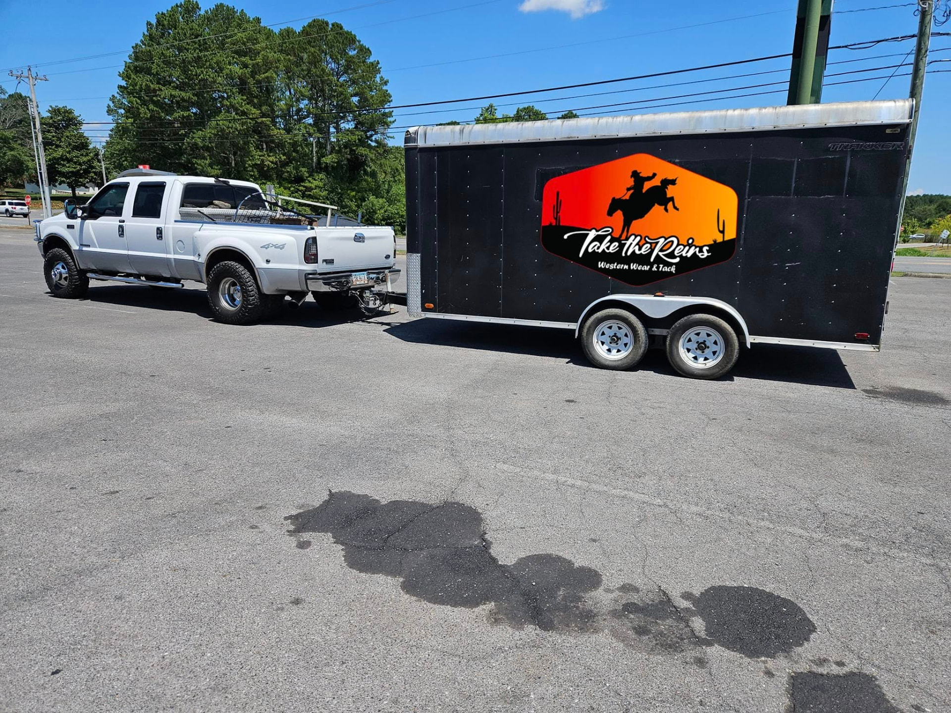 The Take the Reins mobile western store trailer hitched to Tex's truck, ready for an event